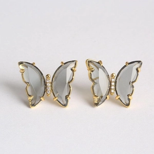Boucles d'oreilles papillon dorées avec ailes en verre gris et mini diamants blancs