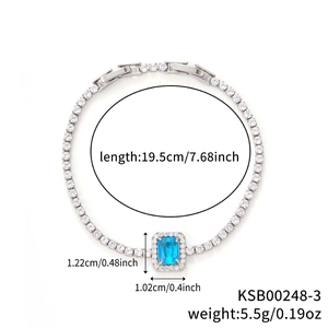 Detail of silver tennis bracelet with sea blue rectangular stone and zircon stones