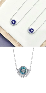 Détail de pendentifs œil bleu avec cristaux radiaux sur une chaîne en argent