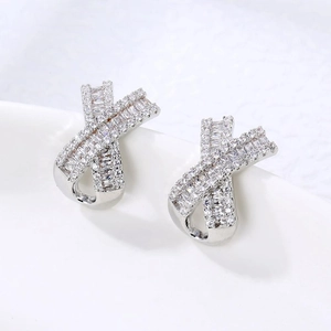 Minimalist geometric cross stud earrings with sparkling pavé cubic zirconia in silver
