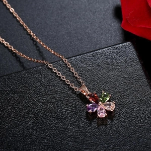 Flower necklace in rose gold with colorful cubic zirconia petals on black box