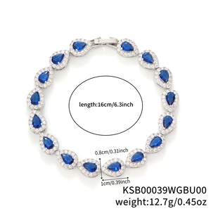 Silver-toned bracelet featuring blue pear-cut zircon stones with micro-pave white crystals