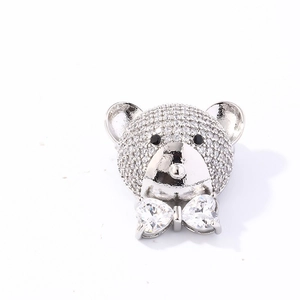Sparkling silver bear stud earrings with micro-pave zircons and a crystal heart bowtie