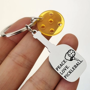Pickleball keychain with engraved stainless steel racket and orange acrylic ball charm