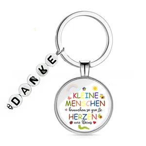 Detail view of German Lucky Clover keychain with DANKE beads and motivational text