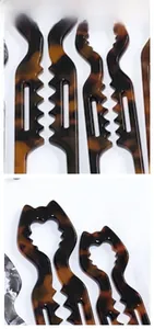 Detail view of wavy tortoise shell U-shaped hair fork with hollow structure design