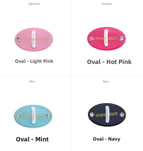 Detail of colorful oval phone case hooks with rhinestones and 3M adhesive backing