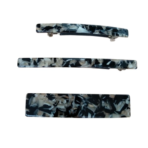 Three elegant long hair clips with black and white marble acetate patterns in three widths