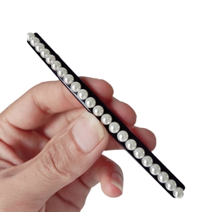 Minimalist black spring hair clip with elegant white pearls for elegant ponytail hairstyles