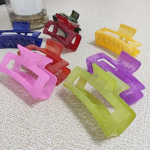 Close-up of assorted colorful square hollow hair claws in various translucent shades