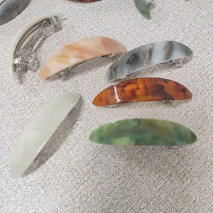 French marble pattern hair clips set in cream, amber, and tortoiseshell acetate