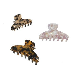Tre mollette per capelli in acetato con motivi tartarugati, marmo viola e beige
