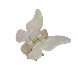 Pince à cheveux papillon élégante avec finition nacrée et ressort métallique robuste