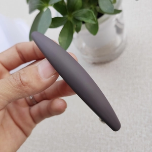 Close-up of a matte dark brown Morandi hair clip with elegant frosted texture finish
