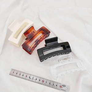 Macro view of 10.5cm large rectangular hair claws in various colors for women
