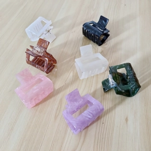 Set of seven minimalist square acetate hair claws in various marble and solid colors