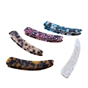 Banana clips set with classic tortoiseshell and ink leopard prints in minimalist style