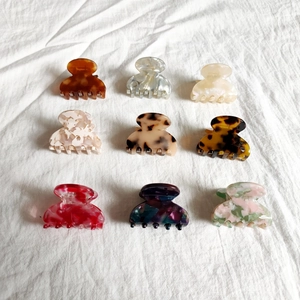 Detailed collection of acetate hair claws in various leopard and marble patterns