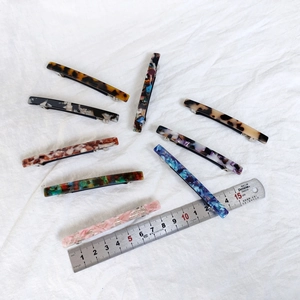 Set of eight 8.5cm acetate spring hair clips in tortoiseshell and marble patterns