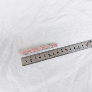 Macro shot of 8.5cm pink marble acetate hair clip with a silver metal spring back clip
