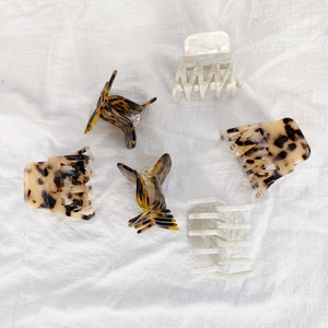 Elegant leopard and pearlescent acetate hair claws in various styles and colors
