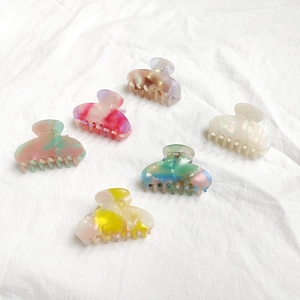 Acetate hair claw clip set for women featuring elegant marble textures and pastel colors