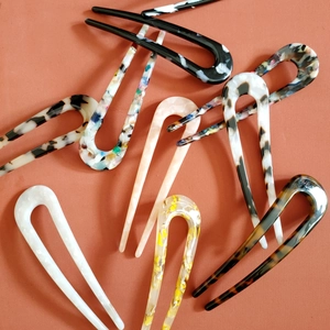 Set of 8 minimalist U-shaped acetate hair pins in various colors and marble patterns