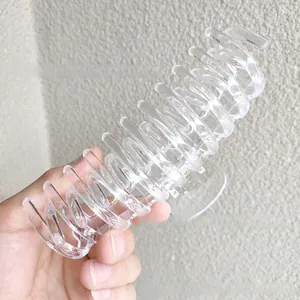 Close-up of a 14cm large clear spiral hair claw clip with strong grip detail