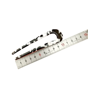 U-shaped acetate hair pin with black and white marble pattern, measuring 10.5cm long