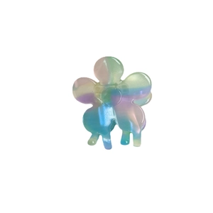 Iridescent flower hair claw clip with macaron pearl finish on a white background