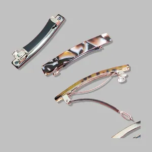 Minimalist acetate hair clips with tortoiseshell and marble patterns on rose gold clips