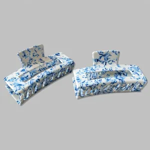 Blue floral pattern rectangular hair claw clips set with glossy marble texture finish