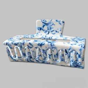 Detailed macro of the blue and white marble pattern on a large square hair claw clip
