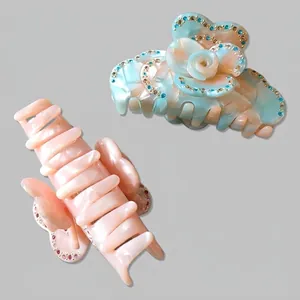Floral and butterfly hair claw clips with rhinestones and marble textured acetate