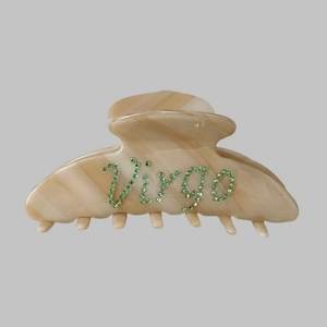 Detail of Virgo rhinestone lettering on large marble pattern hair claw clip