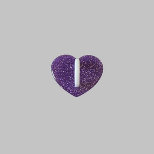 Detail of purple glitter heart phone hook with center white buckle attachment