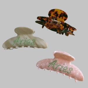 Three-piece large hair claw clips set with Aries rhinestone lettering in various marble patterns