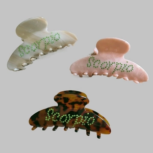 Scorpio rhinestone hair claws in marble beige, translucent pink and tortoise shell colors