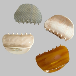 Set of 4 French style acetate hair claw clips in checkered and marble patterns