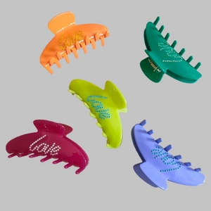 Five-piece colorful resin hair claws with rhinestone 'Love' lettering in multiple shades