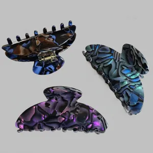 Large tortoiseshell acetate shark hair claws for women in marble and shell patterns