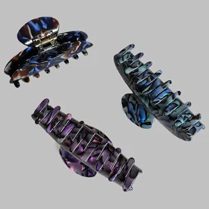 French style large acetate hair claws in marble and tortoiseshell textures for women
