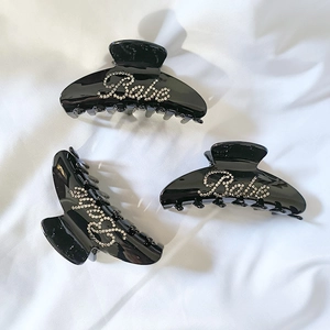 Trois pinces à cheveux noires en acétate avec inscription Baby élégante en strass brillants