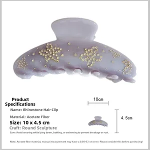 Detailed view of lavender acetic hair claw with gold rhinestones and size specifications