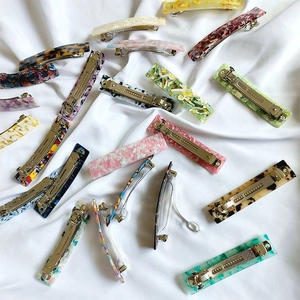 French acetate ponytail clips in diverse marble and tortoiseshell patterns for women