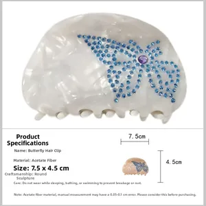 Detail view of acetate butterfly hair claw clip with blue rhinestones and 7.5x4.5cm size chart