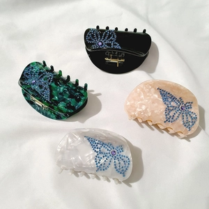 Semicircle acetate hair claws with butterfly rhinestones in four elegant colors