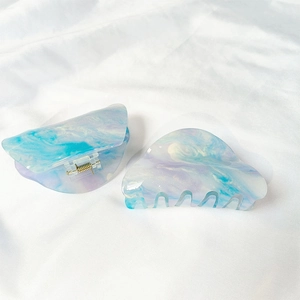 French acrylic marble hair claw clips with iridescent blue and purple glitter finish