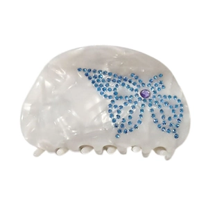 French half-moon hair claw with pearl texture and blue rhinestone butterfly design