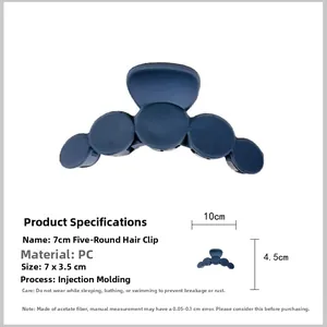 Macro detail of a 7cm navy blue circular hair claw clip made of durable PC material
